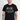 Man wearing a black AC/DC t-shirt with white text on a white background