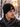 Man wearing a Rolling Stones Classic Tongue Beanie in a snowy forest, showcasing the iconic tongue logo.