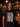 Iron Maiden Eponymous Face Red Logo T-Shirt worn by a man in a bar setting.