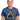 Pink Floyd Dark Side of The Moon 1973 T-Shirt worn by a smiling man, featuring the iconic album logo and rainbow design.