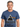 Pink Floyd Dark Side of The Moon 1973 T-Shirt worn by a smiling man, featuring the iconic album logo and rainbow design.