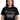 Man wearing a Pink Floyd Christmas Prism T-Shirt featuring a festive design with snowflakes and the iconic triangle logo.