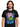 Megadeth Radioactive Classic T-Shirt worn by a man, featuring a colorful graphic design with a skeleton and vibrant background.