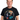 Man wearing Styx US Tour 79 Vintage Black T-Shirt featuring colorful graphics and band logo.