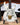 Steve Vai Signature White JEM Miniature Guitar showcasing intricate details and design on display.