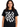 The Go-Go's Classic Logo T-Shirt displayed on a model wearing a black t-shirt with a bold logo design.