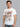 Def Leppard Group White T-shirt featuring band members in British flag attire, perfect for fans of the rock band.