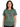 The Beatles Strawberry Fields T-Shirt worn by a model, featuring colorful strawberry design and green fabric.