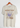 Woodstock Wild Flowers Natural T-Shirt displayed on hanger, featuring flower design and purple bird illustration.